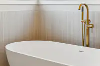 20 _ 3208 Camino Colorados _ Bathroom soaking tub with a gold faucet and tiled walls