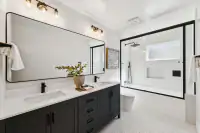 22 _ 3208 Camino Colorados _ Bathroom with a double vanity, mirrors, and glass shower