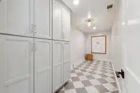 28 _ 3208 Camino Colorados _ Walk in closet with built in cabinets and tiled flooring