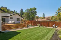 30 _ 3208 Camino Colorados _ Backyard with a deck, lawn, and fenced yard