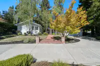 2 _ 4022 Happy Valley Road _ Front view with brick walkway, landscaped yard, and trees
