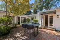 7 _ 4022 Happy Valley Road _ Backyard with brick patio and outdoor dining area