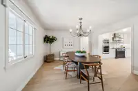 9 _ 4022 Happy Valley Road _ Dining Room with large windows and chandelier
