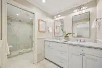 21 _ 4022 Happy Valley Road _ Bath with double vanity and glass-enclosed shower