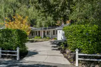 36 _ 4022 Happy Valley Road _ Front exterior with curved driveway and landscaped entry