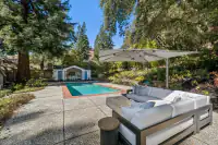 28 _ 4022 Happy Valley Road _ Backyard with pool and covered seating area