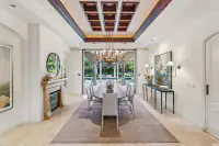 11 _ 24 Cosso Court _ Dining Room with a chandelier, fireplace, and backyard view