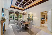 13 _ 24 Cosso Court _ Kitchen with a large island, wooden cabinetry, stainless steel appliances, and exposed ceiling beams