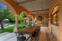 21 _ 24 Cosso Court _ Backyard covered patio with outdoor dining table and built-in grill