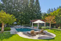 25 _ 24 Cosso Court _ Backyard swimming pool with lounge chairs and covered pergola
