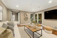 26 _ 24 Cosso Court _ Family Room with sofa seating and wall-mounted television