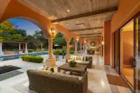 29 _ 24 Cosso Court _ Covered patio with outdoor seating and pool view