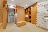 31 _ 24 Cosso Court _ Walk-in closet with built-in cabinets and shelving