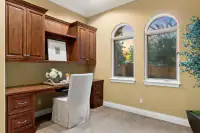 34 _ 24 Cosso Court _ Built-in desk with overhead cabinets and arched windows