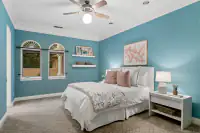 41 _ 24 Cosso Court _ Bedroom with teal walls and floral bedding