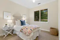 42 _ 24 Cosso Court _ Bedroom with animal print bedding and blue accent pillow