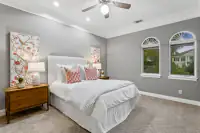 39 _ 24 Cosso Court _ Bedroom with gray walls and floral artwork
