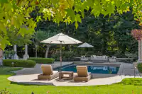 55 _ 24 Cosso Court _ Backyard with swimming pool, paved patio, and outdoor seating