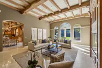 24 _ 24 Cosso Court _ Family Room with seating area and arched windows facing the backyard